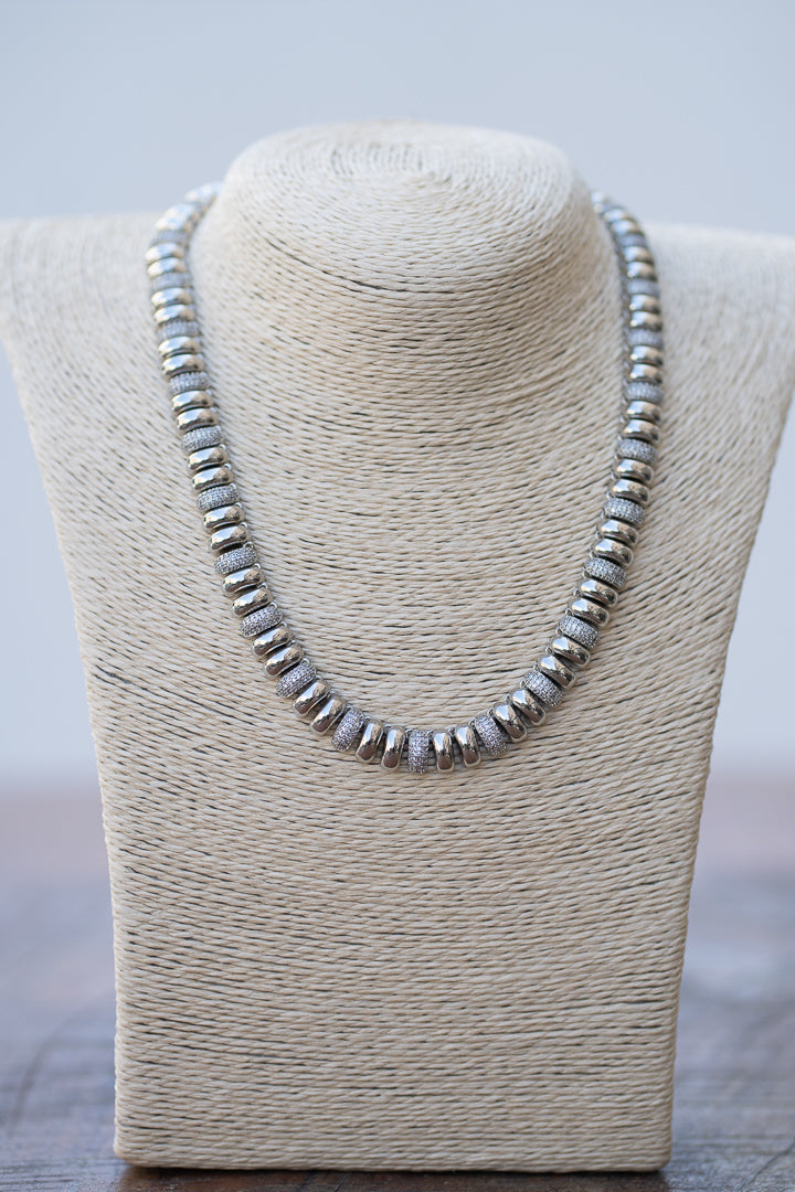 Silver-tone metal chain and shiny
